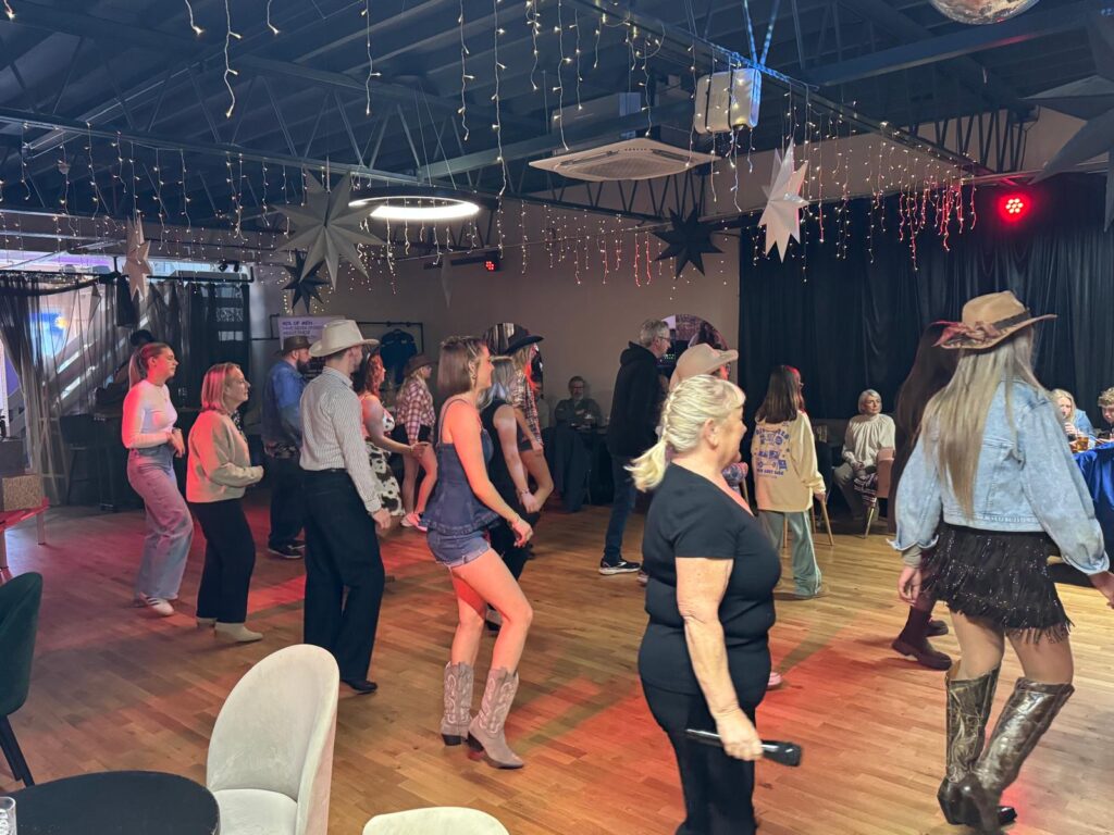 A full class mid-laugh, or a busy social night